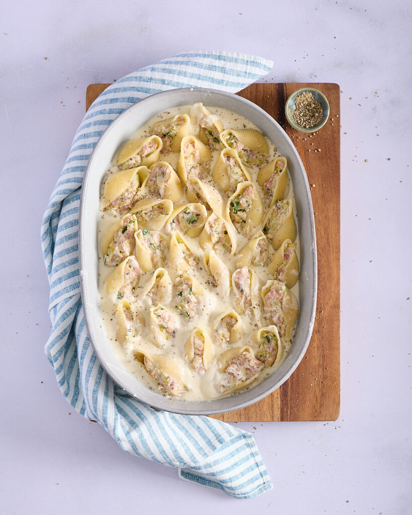 Ready to bake stuffed pasta shells with fennel cream.